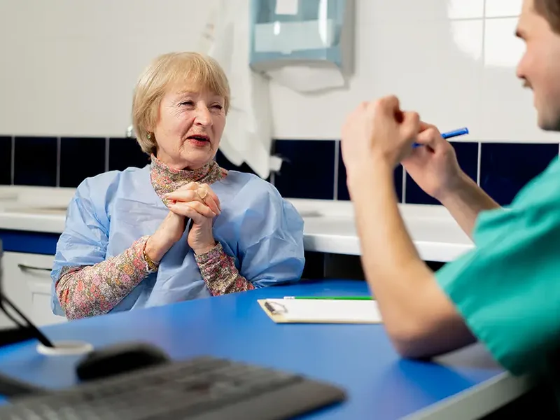 Physical therapist assessing a patient's mobility before and after surgery