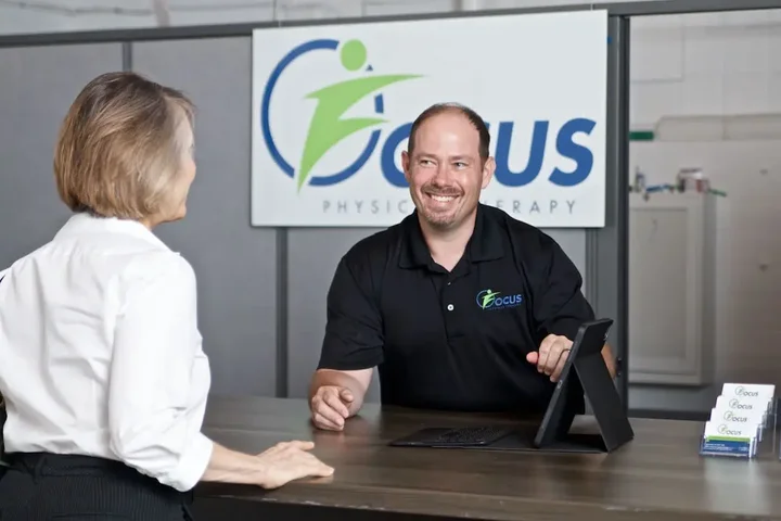Checking in at the front desk at Focus Physical Therapy